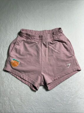 Gymshark Women's Mauve Pink Athletic Lounge Shorts with Peach Graphic